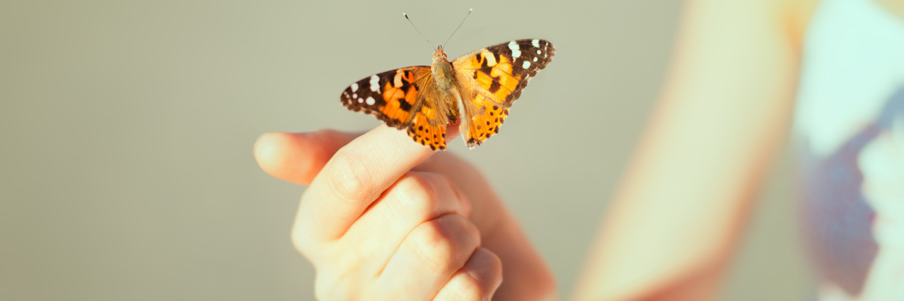 How Gastroparesis Changed My Body A woman with a butterfly