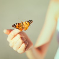 A woman with a butterfly