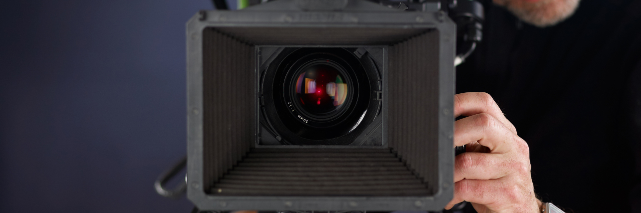 Increasing Disability Inclusion in Film and TV Cameraman working with a movie camera.