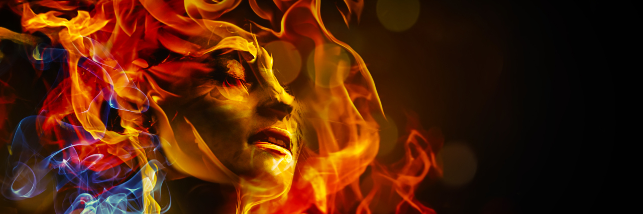What Millennial Burnout Feels Like When You Have a Disability Illustration of woman's face made with fire.