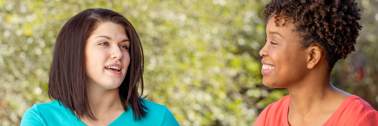 Direct Support Workers Improve Emotional Health of People With Autism Two women talking outdoors.