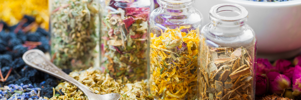 Herbalist Who Treated Boy With Type 1 Diabetes Sentenced to Jail Bottles of healing herbs and mortar with dry lavender flowers, herbal medicine.