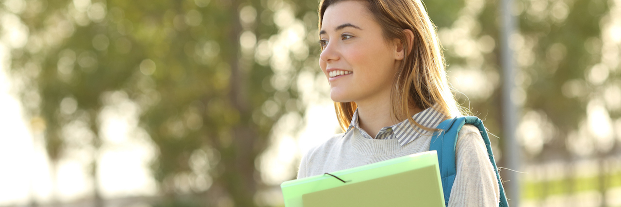 How a Professor Responding to My Feeding Tube A student wearing a backpack walking outside
