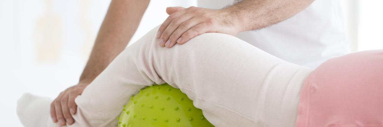 Why CNAs Need More Education About Patients With Disabilities Woman doing rehabilitation in hospital.