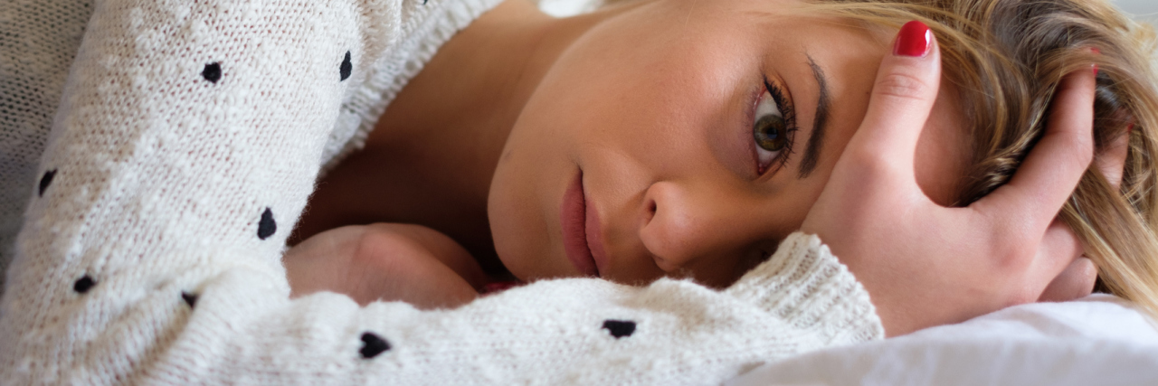 Serotonin Syndrome: A Potentially Fatal Side Effect of Antidepressants photo of woman lying in bed trying to sleep