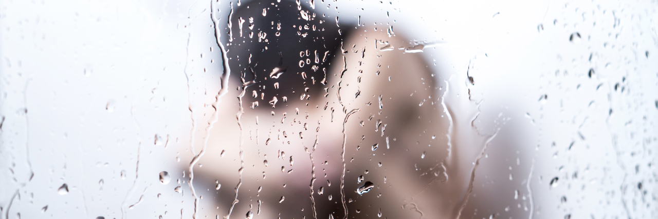When Taking a Shower Would Trigger My Tears a girl is sitting with her head down on the floor of a shower