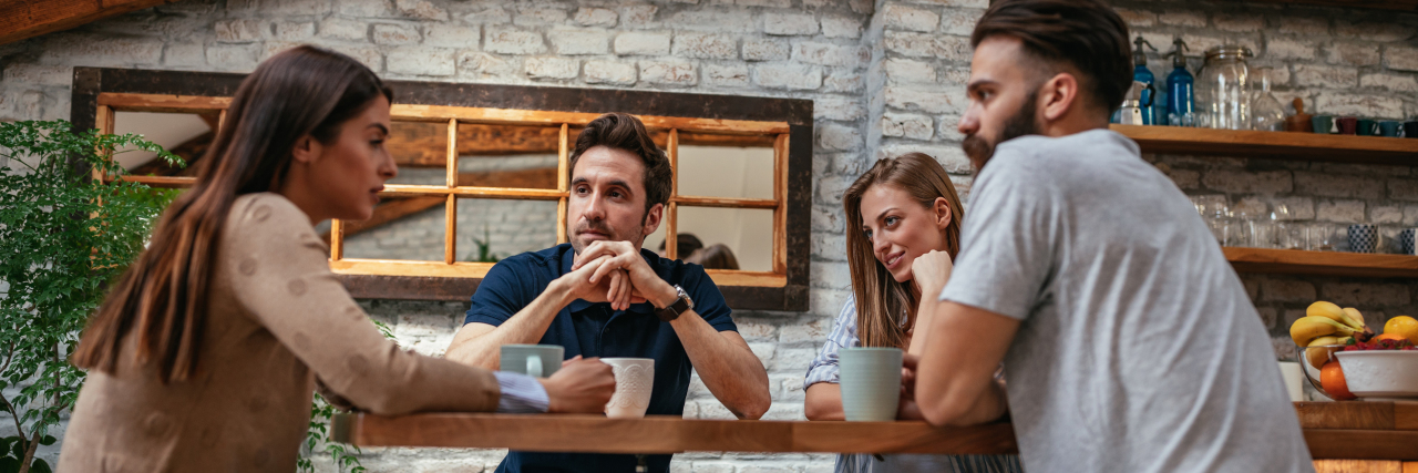 Mental Health: Saying 'I'm OK' Even When You're Not group of friends talking