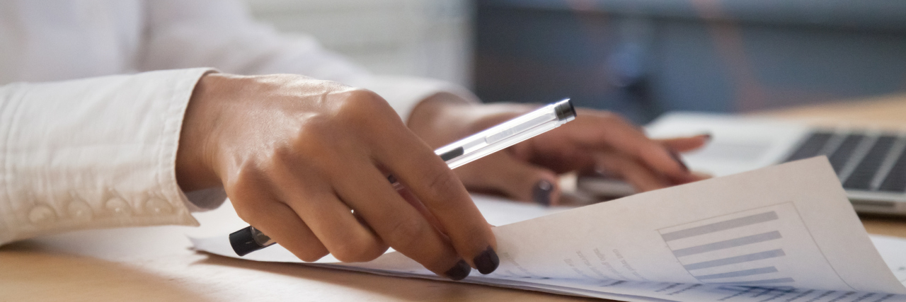 Companies That Regularly Hire Autistic Workers African american businesswoman analyzing project statistics result in report working with graphs documents and laptop in office, strategic planning and financial data analysis concept, close up view