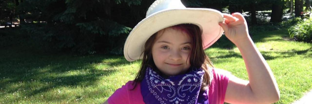 Summer Camps for Kids With Disabilities by State Summer camps for kids with disabilities. Little girl with Down syndrome holding on to cowboy hat.