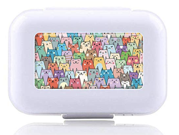 A pill box with a rainbow of cute cats on it.