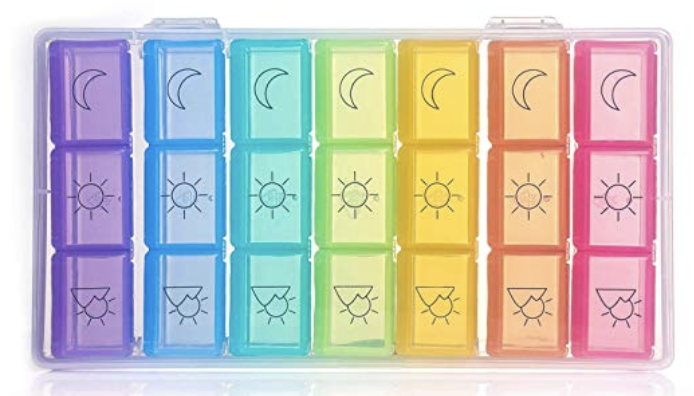 A rainbow-colored pill box, labeled with a sun, a moon, and a sunset for different times to take pills.