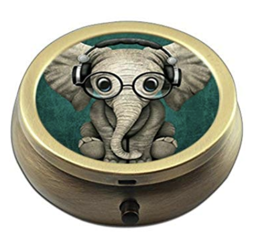 A pill box with an elephant wearing glasses and headphones on it.