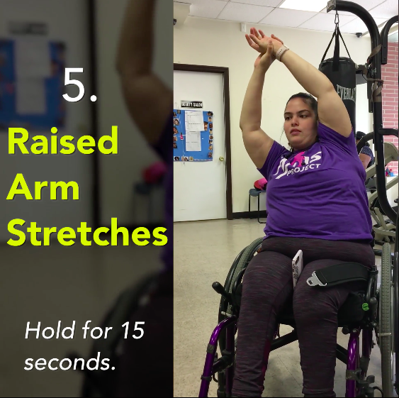 woman in a wheelchair performing a raised arm stretch