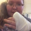 Meghan Collen holding up her hand bandaged after cutting off her finger