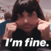 Jameela Jamil stretching her cheeks with the caption "I'm fine"