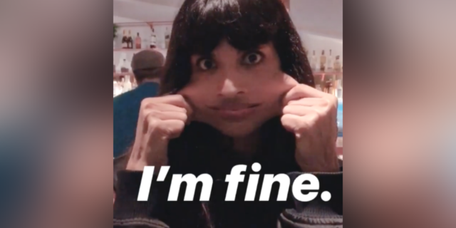 Jameela Jamil stretching her cheeks with the caption "I'm fine"