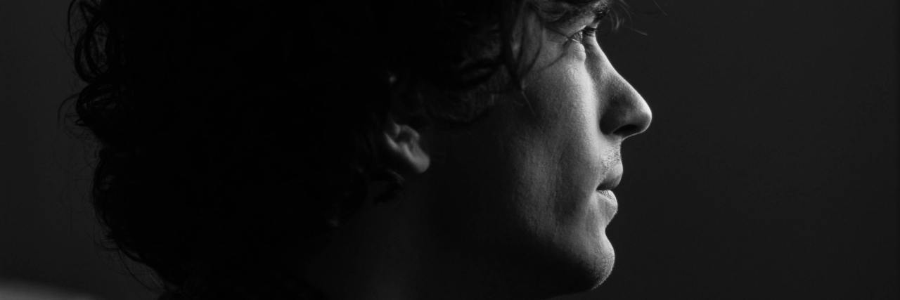 How Anxiety Kept Me From Interviewing for My Dream Job close up black and white photo of man looking sad or stressed