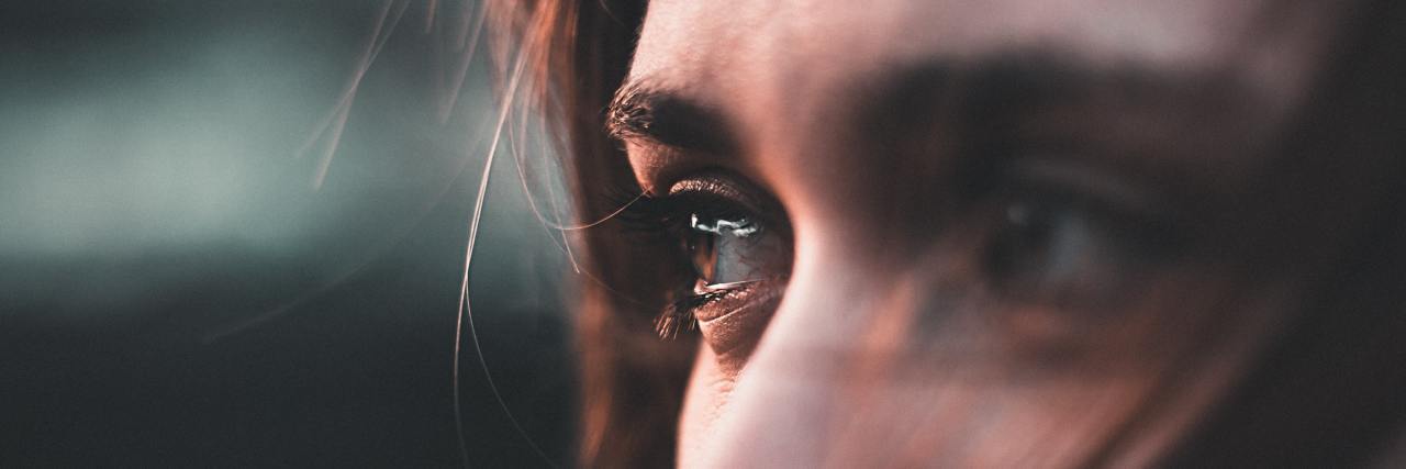 How to Deal With Difficult, Uncomfortable Emotions close up photo of woman's eyes filled with tears