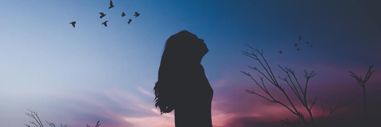 What the NEDA Week 2019 Theme Means to Me and My Recovery Journey photo of woman silhouetted against afterglow of sunset with moon, birds and field grass