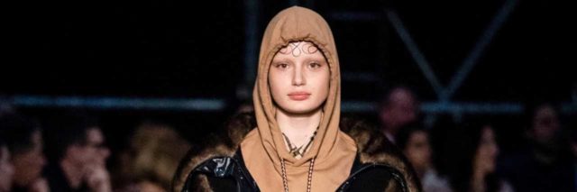 Model wearing Burberry hoodie with imagery that could be interpreted as a reference to suicide