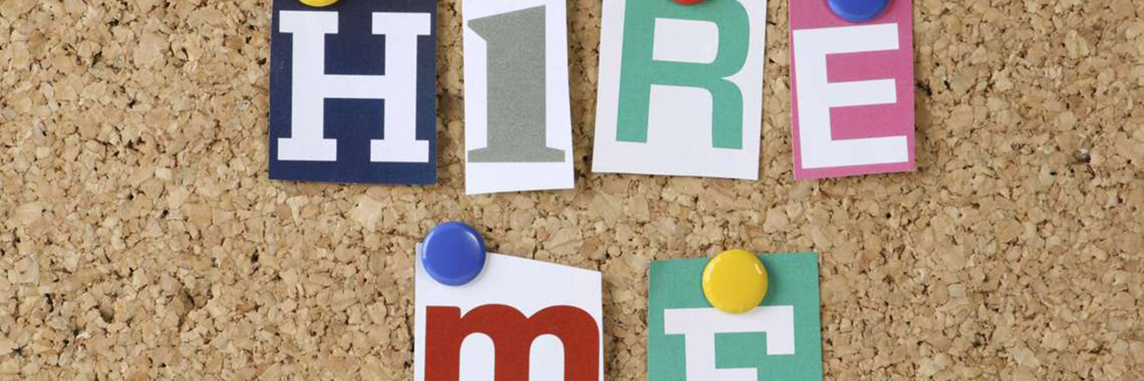 Cutout letters that say "Hire Me" on cork board.
