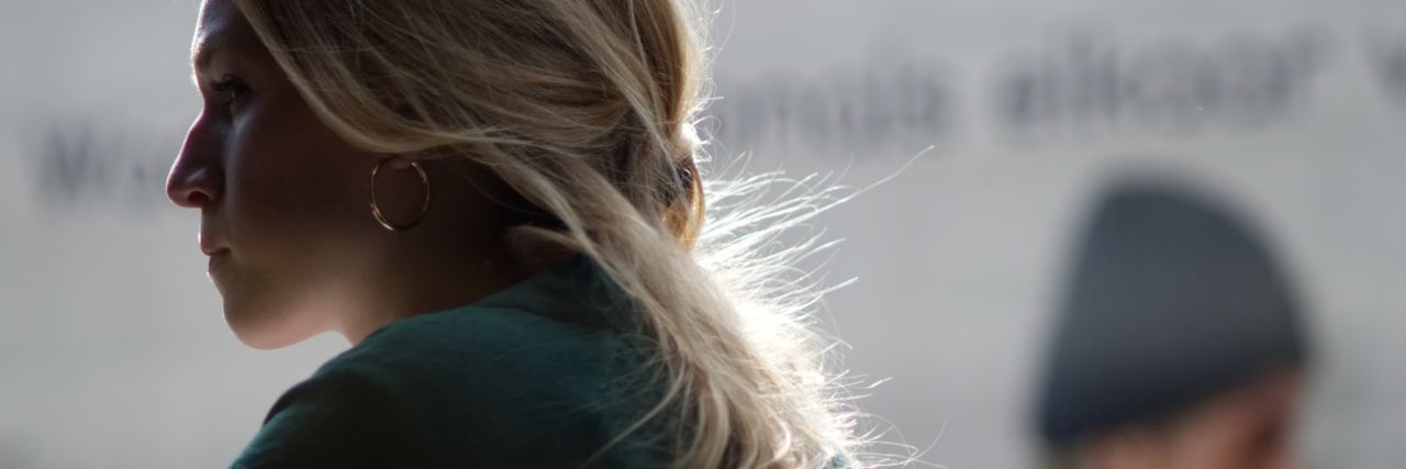 photo of blonde woman in profile looking angry