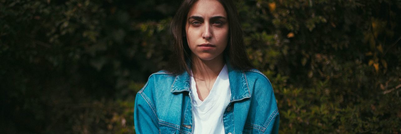 Rape Is a Crime, Not Something to Joke About photo of woman wearing blue jacket looking stern into camera