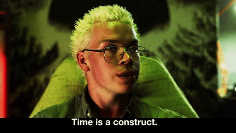 GIF of a man with blonde spiky hair saying, Time is a construct