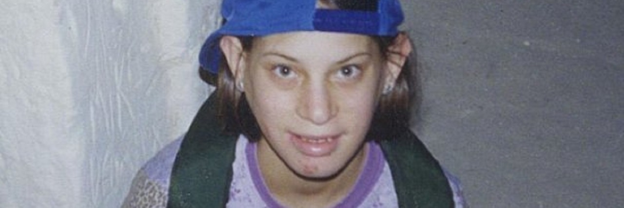 A Mother's Grief 16 Years After Her Daughter's Death a girl sitting and smiling for the camera