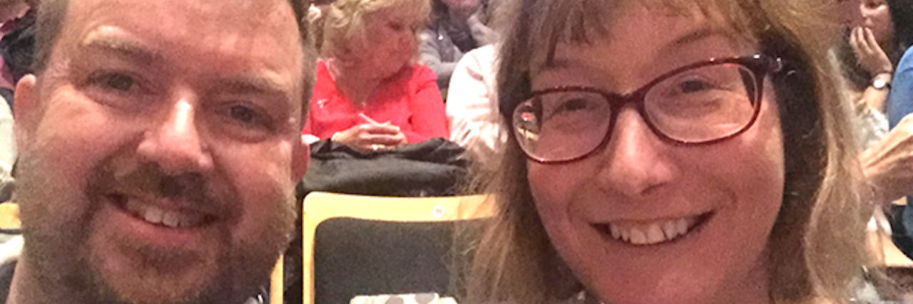 Confessions of Dad Who Parents a Child With a Disability Husband and wife smiling at camera