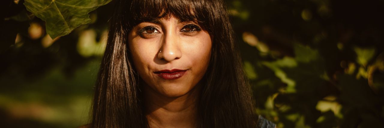 Deciding How to Manage and Treat Your Chronic Illness close up portrait of a woman smiling outside