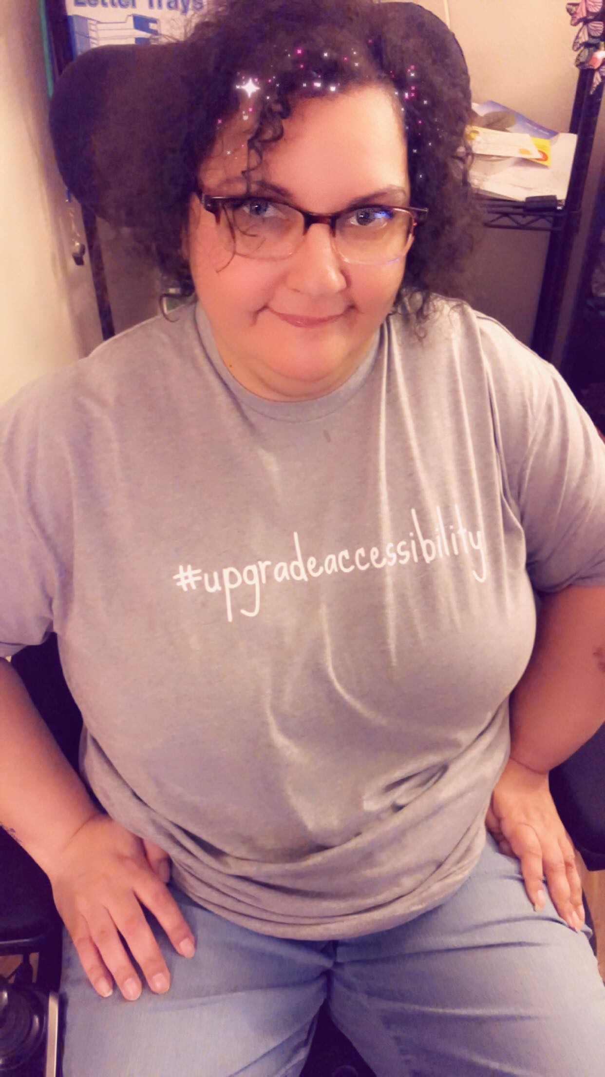 Mary wearing an #upgradeaccessibility t-shirt.