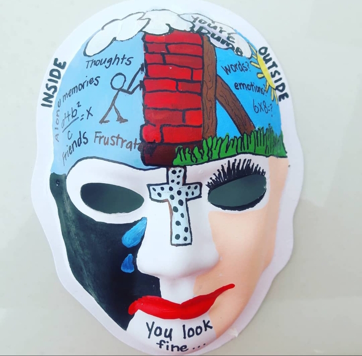 Shelly's mask depicting her experiences with traumatic brain injury. (Described in text below.)