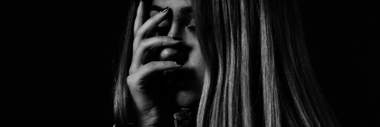 17 Things People Don't Realize You're Doing Because You Think Everyone Hates You A distressed woman covers her face with her hand. 17 Things People Don't Realize You're Doing Because You Think Everyone Hates You