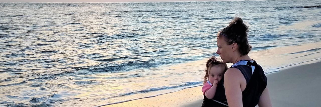 Finding Grace as the Parent of a Child With a Disability Kelly Simpson with her daughter on the beach.