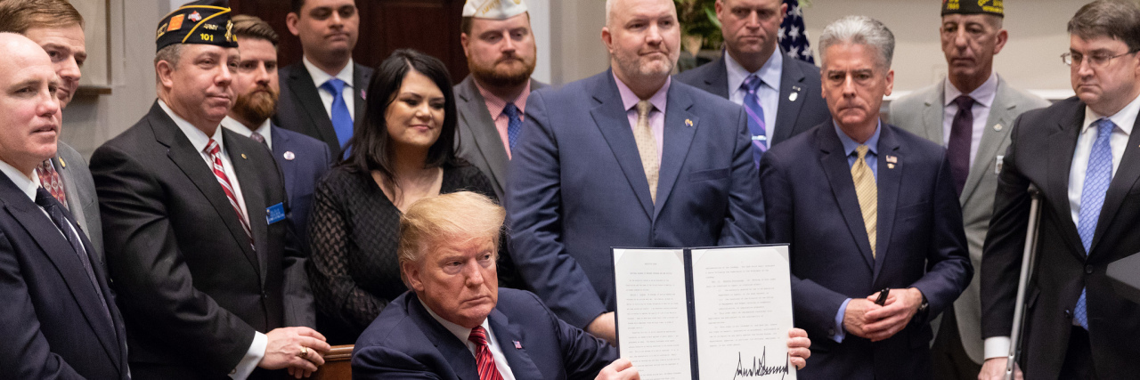 President Trump Signs Executive Order for Veteran Suicide Prevention President Donald J. Trump displays his signature after signing an executive order for a “National Roadmap to Empower Veterans and End a National Tragedy of Suicide