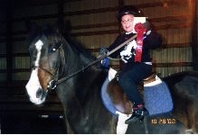 Kelsey riding as a child.