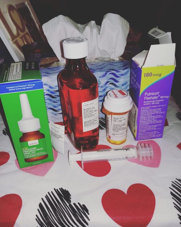 multiple medicine bottles and tissues