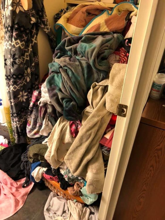 messy closet pile clothes