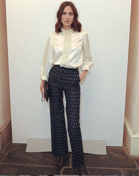 Alexa Chung in white shirt and black pants