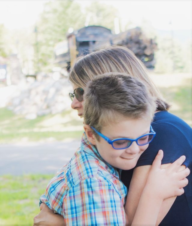 the author hugging her child