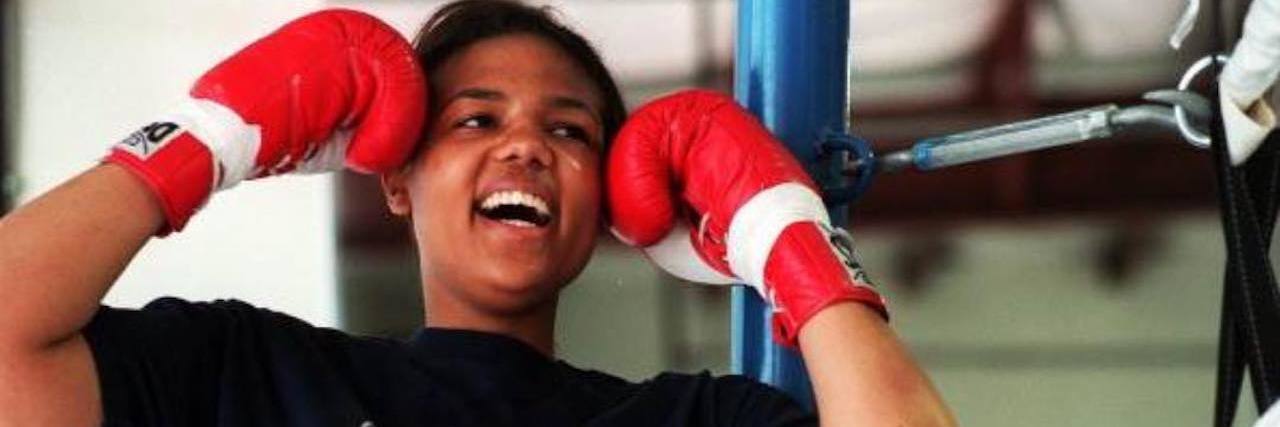 George Foreman's Daughter, Freeda, Dies by Apparent Suicide at 42 Freeda Foreman wearing boxing gloves