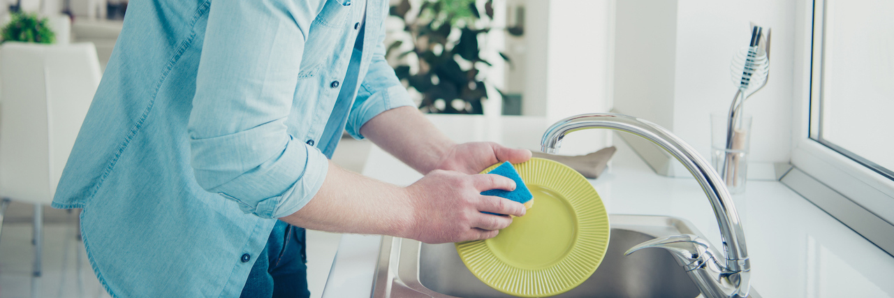 Ideas for Improving the Mental Health Care System man doing the dishes