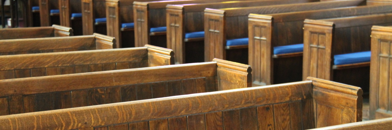 Growing Up in a Fear-Based Church as a Survivor of Childhood Sex Abuse pew seats in a church