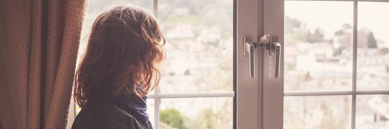 What to Know After Receiving a Rare Diagnosis Young woman is looking out the window