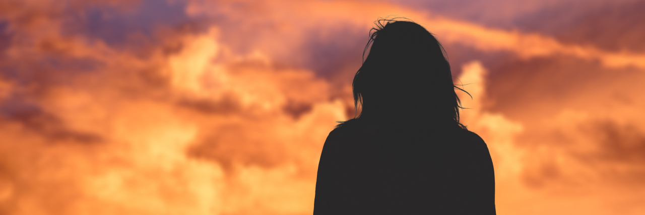 Living With a Primary Immune Deficiency: What Others Can't See silhouette of woman watching the sky