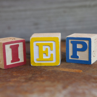 Wooden blocks with the letters I E P