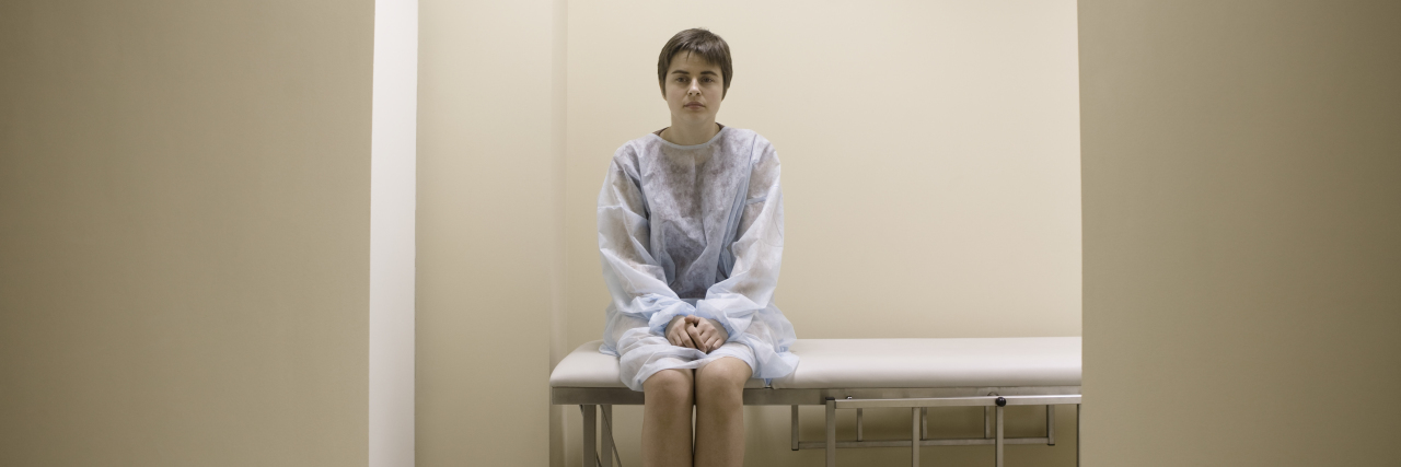 Full length portrait of a woman waiting for medical examination