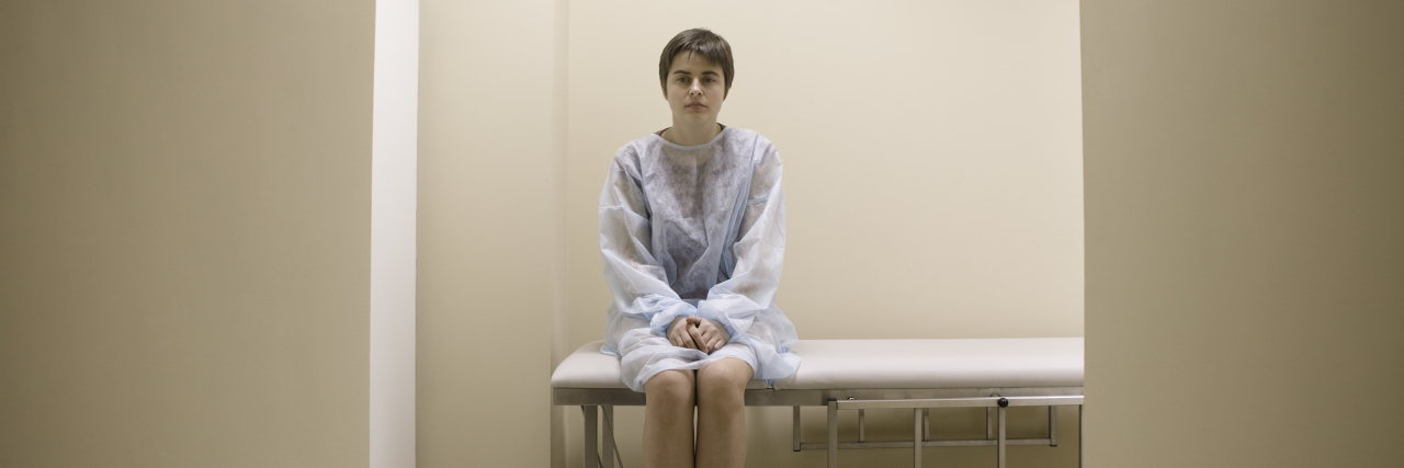 Splenic Aneurysms: What to Know With a Chronic Illness Full length portrait of a woman waiting for medical examination