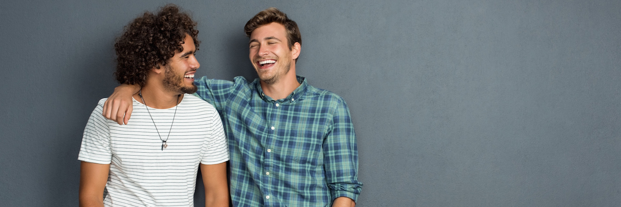 Bipolar Disorder: Tips for Managing Strong Relationships Two men laughing and embracing each other